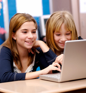 Two girls at a computer